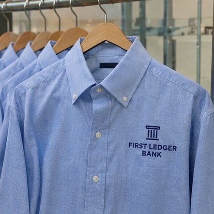 Custom bank staff dress shirts on hangers