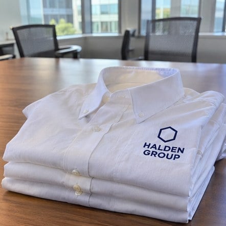 Custom office dress shirts on a meeting table